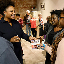 Tracy K. Smith chats with and signs copies of "American Journal" for audience members at the Jean Lafitte Wetlands Acadian Cultural Center in Thibodaux, LA. December 14, 2018. Credit: Kevin Rabalais.